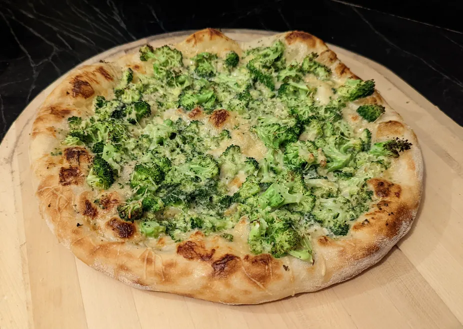 Broccoli Alfredo pizza, baked on a steel.