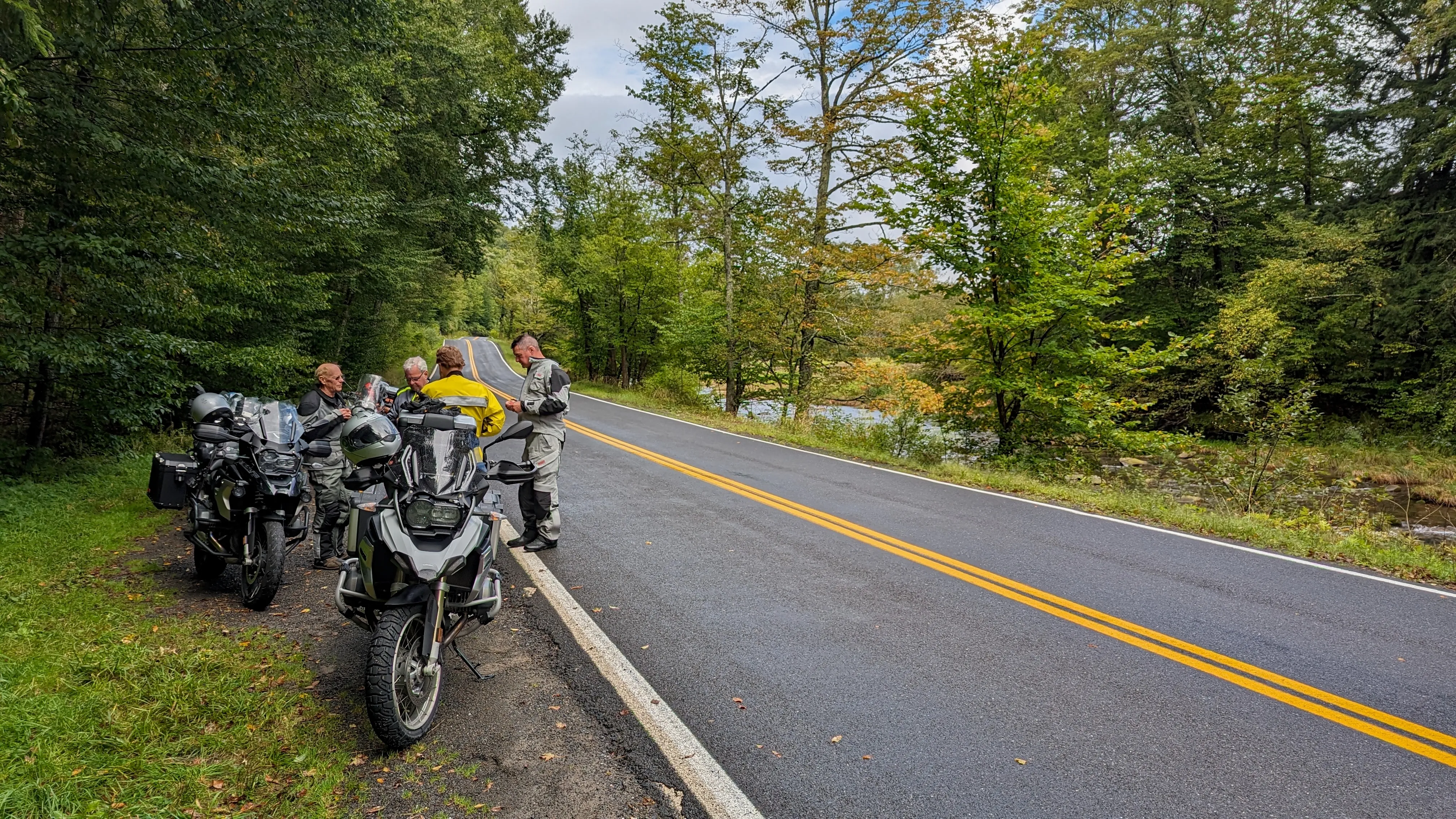 Motorcycles stopped on the roadside near the Catskills.