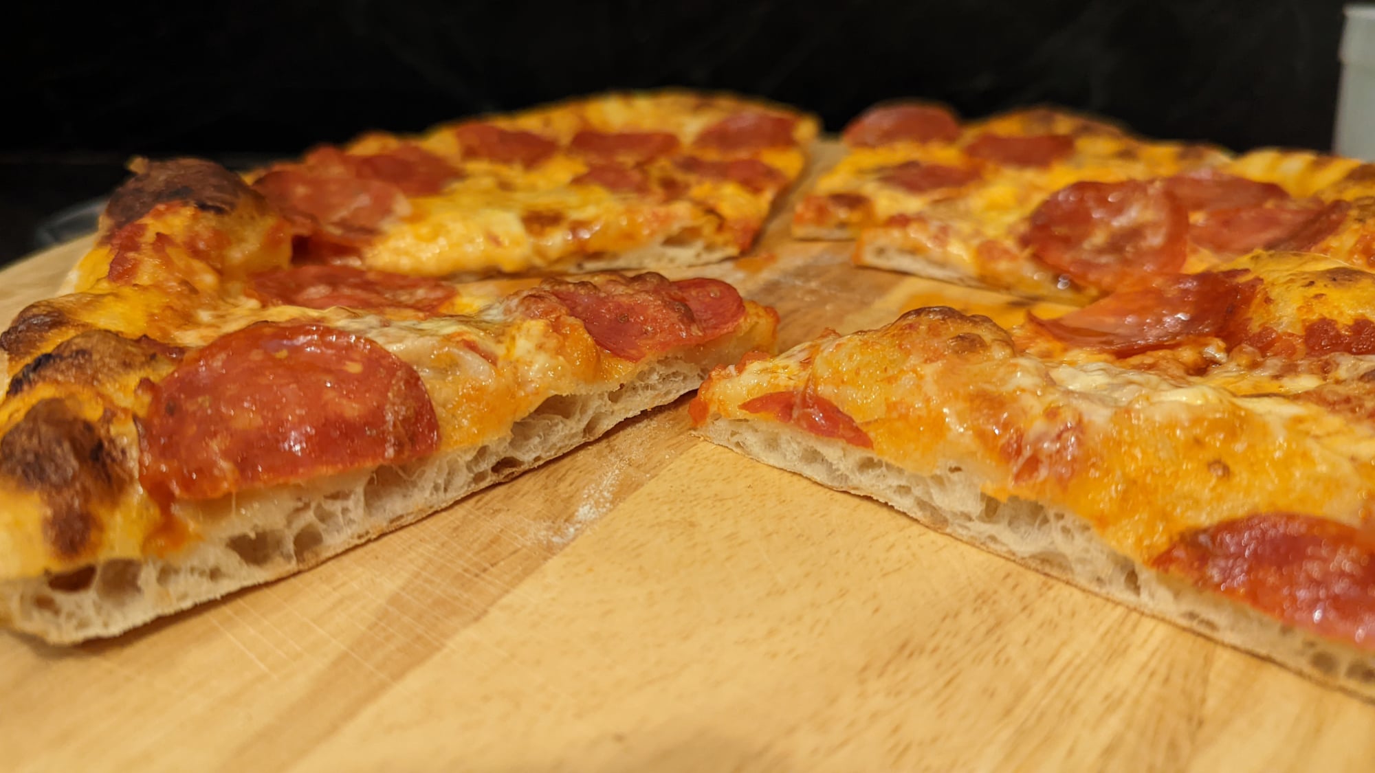 A pizza baked on a steel.